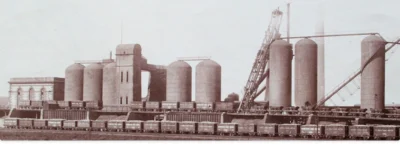 Carnforth Iron Works with eight furnace chimneys and two rows of engine wagons